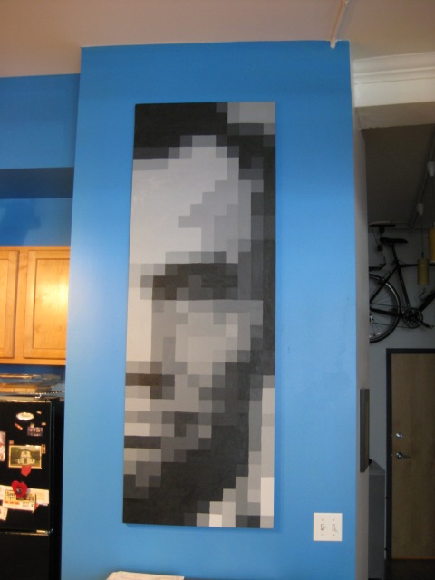 Pixelated grey scale Lincoln portrait.